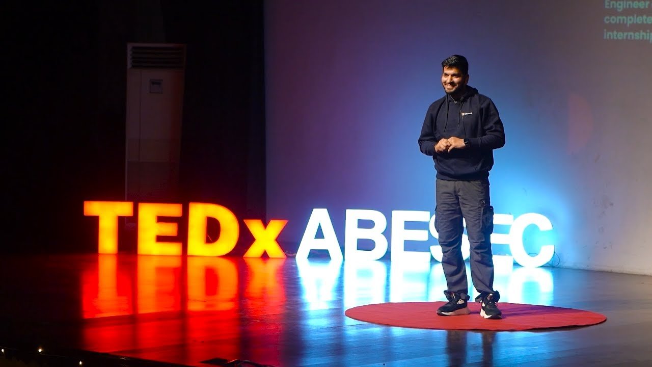 Love Babbar speaking at TEDx in June 2023, where he shared a story about a missing '#' in his code disrupting Amazon's delivery system.